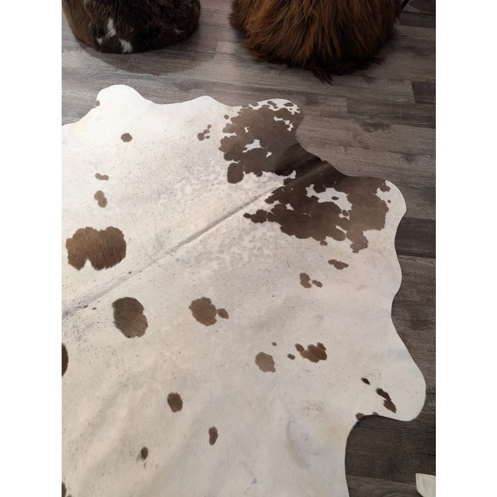 Large cowhide rug t37 74 x 67 with white base and brown patches featuring an organic asymmetrical shape by angus oliver