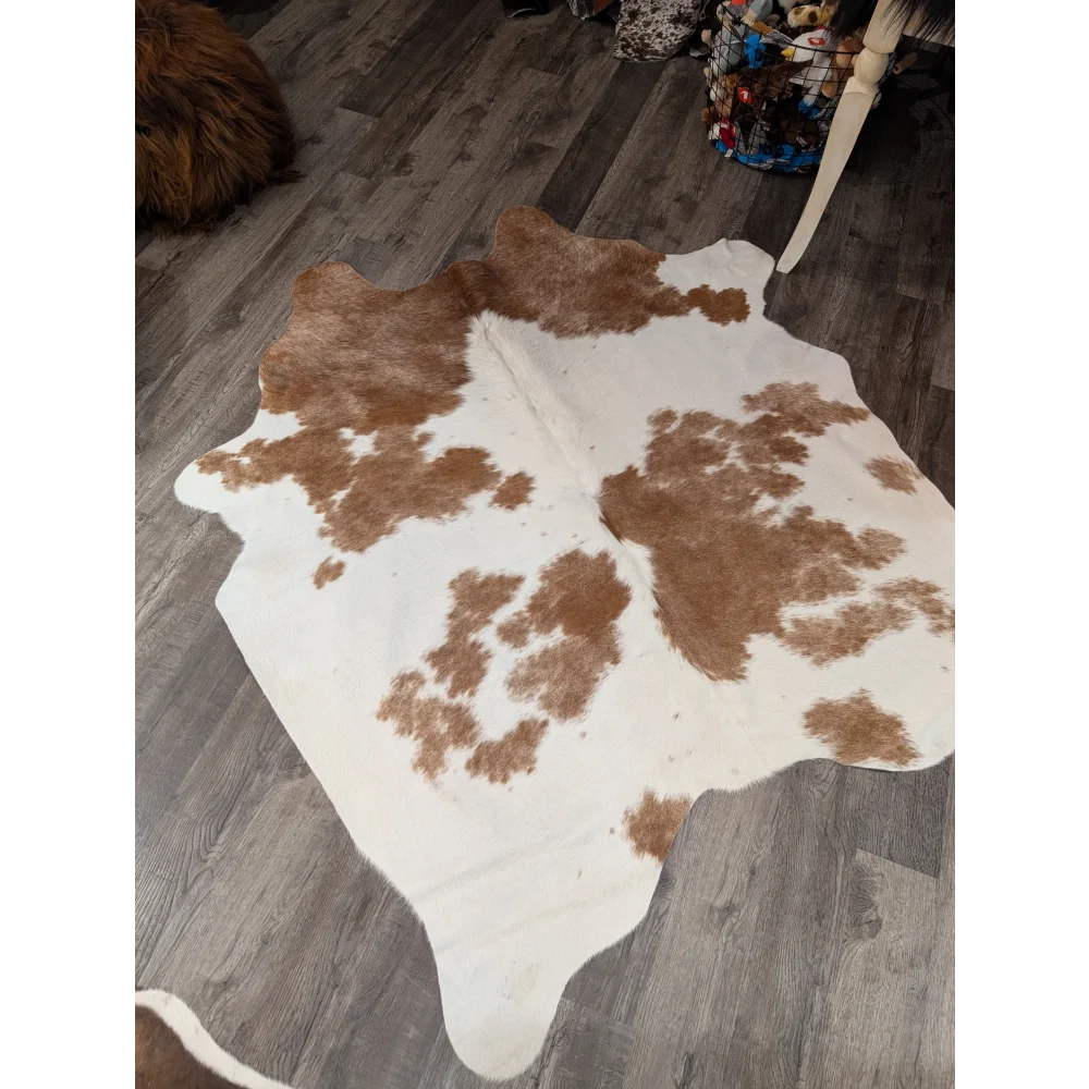 Large cowhide rug t38 74 x 57 with white base and irregular brown patches featuring angus oliver texture