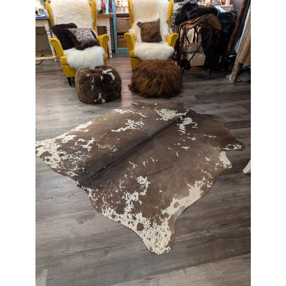 Large cowhide rug angus oliver with natural brown and white irregular patterns measures 72 x 62 inches