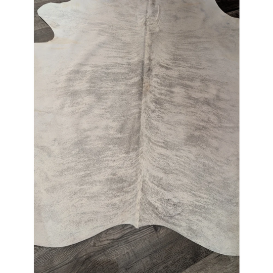 Large cowhide angus oliver rug in natural white with soft texture and subtle grayish markings perfect for home use