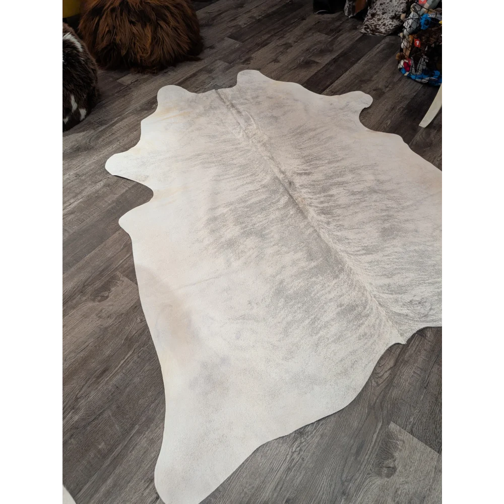 Large white angus oliver cowhide rug with soft texture and subtle gray markings perfect for any room