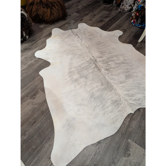 Large white angus oliver cowhide rug with soft texture and subtle gray markings perfect for any room