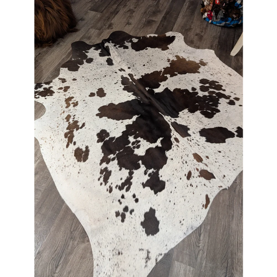 Large cowhide rug t42 69 x 66 with white and brown irregular patches and angus oliver style spots