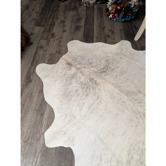 Large cowhide rug t44 74 x 65 white with natural edges and subtle grayish brown markings by angus oliver