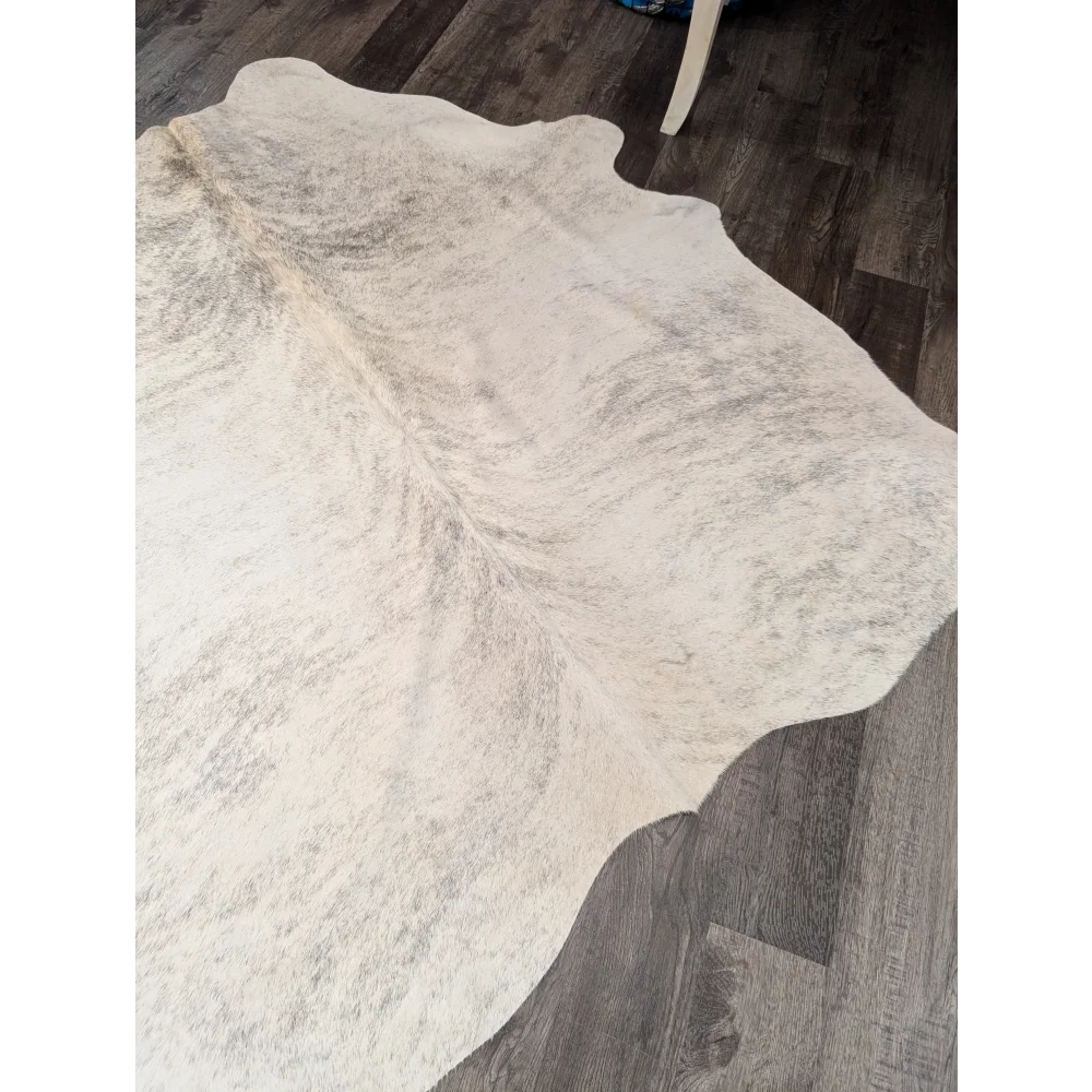 Large white and gray cowhide rug with soft textured surface perfect for stylish home decor by angus oliver