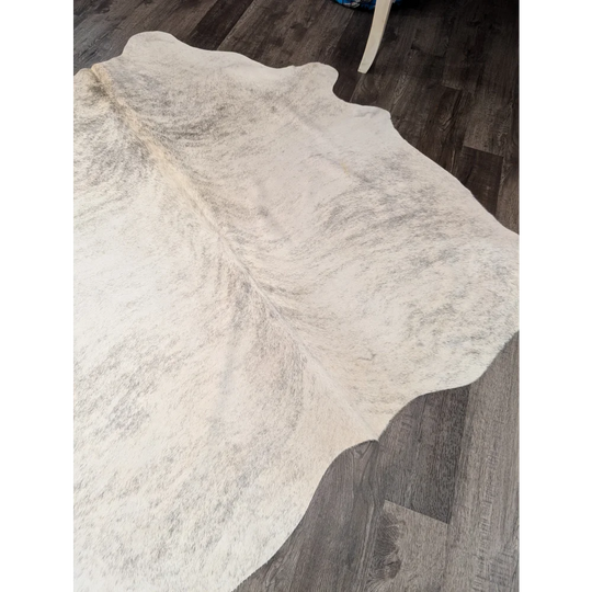 Large white and gray cowhide rug with soft textured surface perfect for stylish home decor by angus oliver
