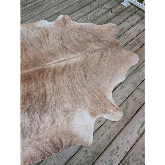 Large cowhide rug t6 80 x 70 with natural tones soft texture and unique characteristics with irregular edges