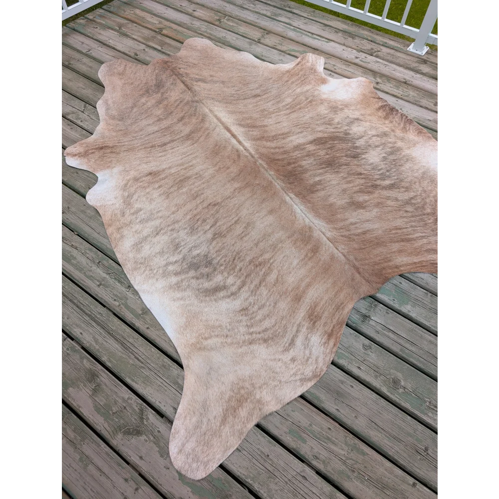T6 80 x 70 large cowhide rug with tan and white natural colors and unique characteristics in a textured shape