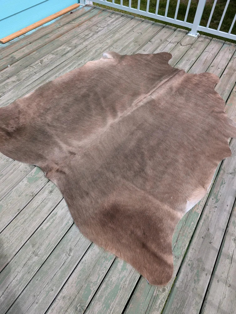 Large cowhide rug t9 with natural brown color soft texture and unique characteristics perfect for any space