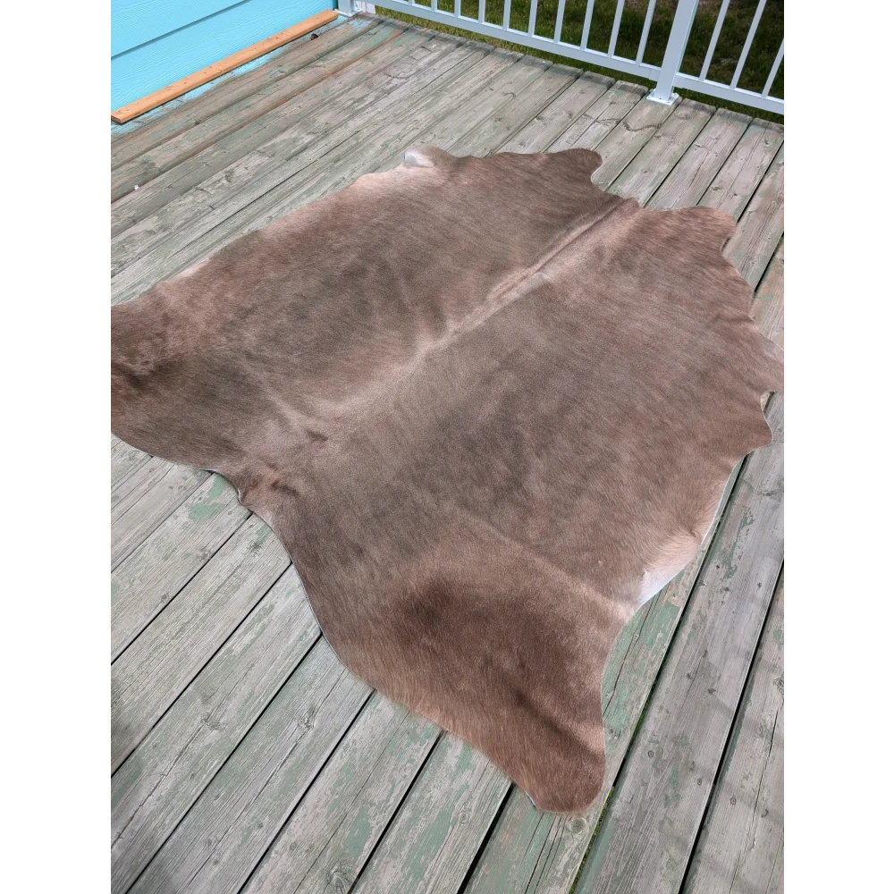 Large cowhide rug t9 with natural brown color soft texture and unique characteristics perfect for any space