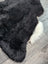 Large 43 x 33 black and white icelandic sheepskin rug with plush natural short wool texture perfect for cozy spaces