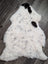 Large spotted icelandic sheepskin rug in white with black and gray speckles made from short wool