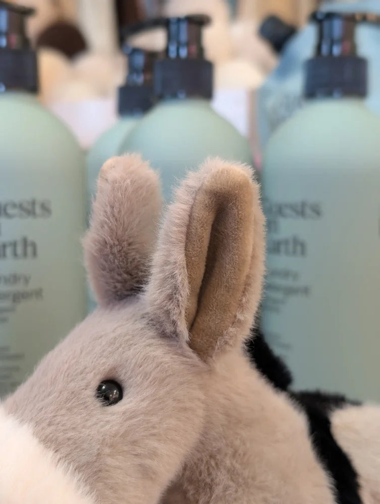 The donkey fuzzy gray bunny-shaped bath sponge with soft plush ears and black bead eye for gentle cleaning