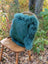 Teal fur-lined handbag with soft woolly green sheepskin and structured rectangular shape from sewing studio