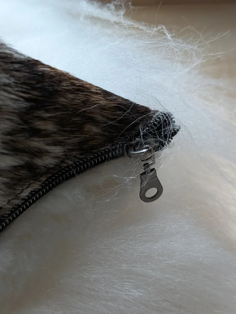 The moo cushion brown and white long wool zipper pouch with silver pull tab by angus oliver for sewing machines