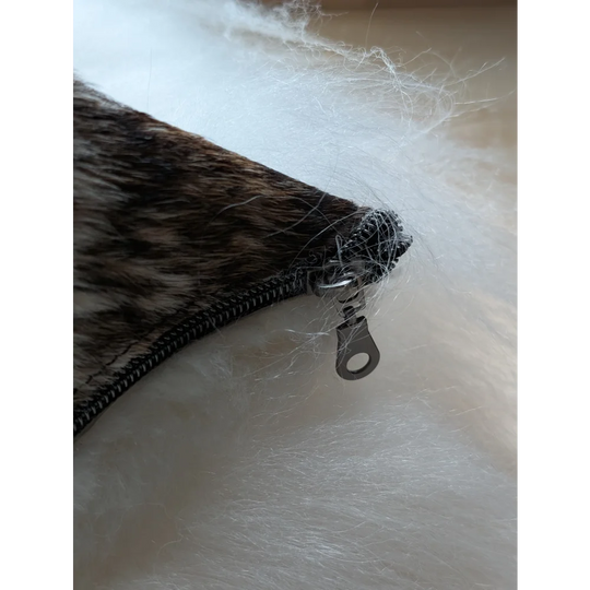 The moo cushion brown and white long wool zipper pouch with silver pull tab by angus oliver for sewing machines