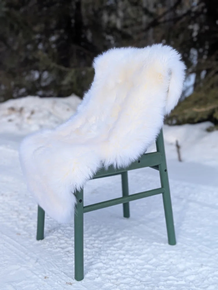 White faux fur throw on green chair, gorgeous Merino sheepskin OEKO TEX certified