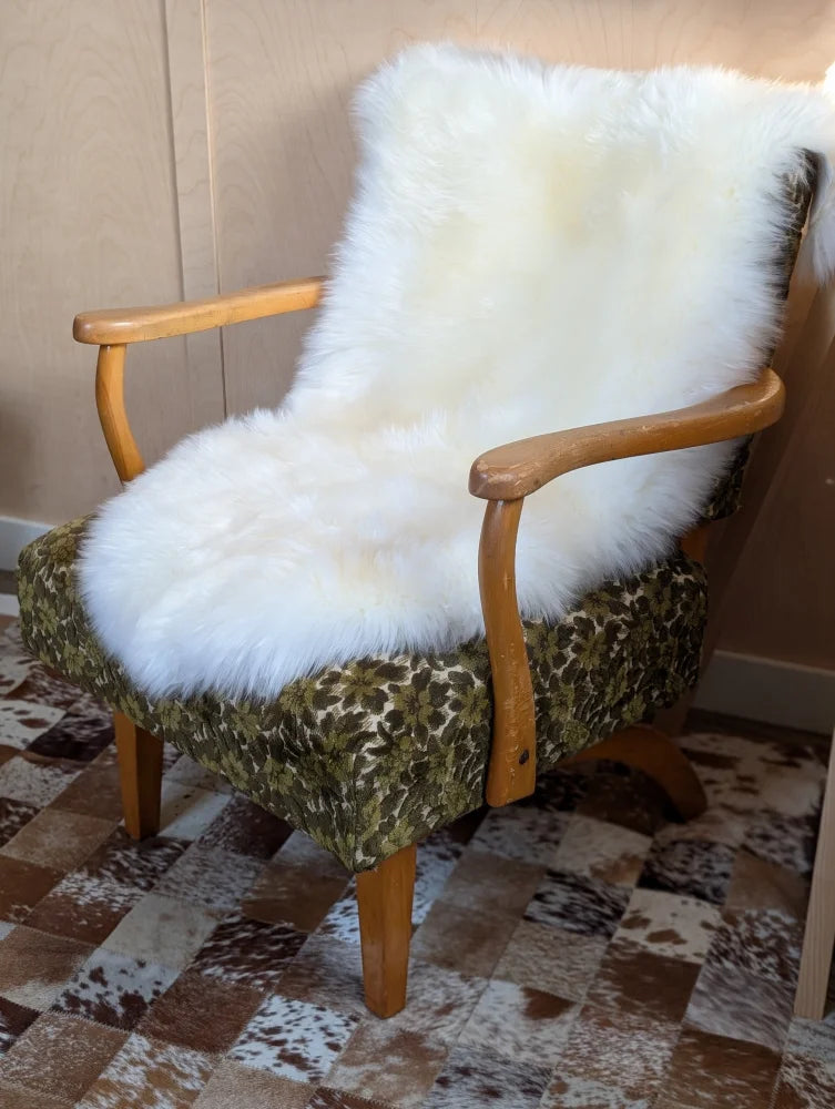 Gorgeous Merino sheepskin throw on green armchair, OEKO TEX certified