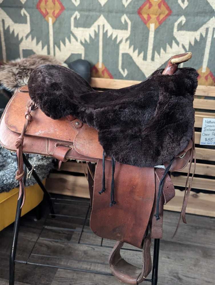 Brown merino sheepskin western saddle cover with silver hardware