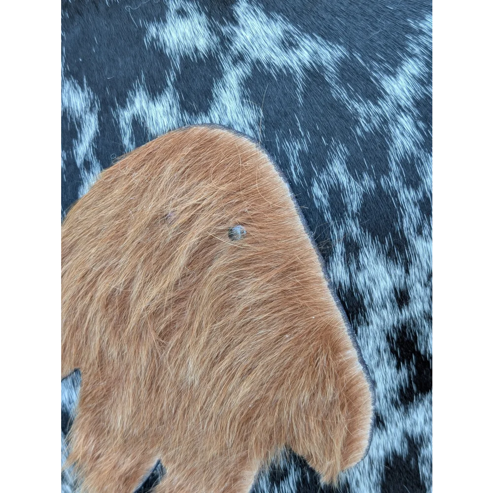 The yeti cushion cowhide patch features brown long wool icelandic sheepskin with a small dark spot perfect for sewing machines