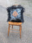 Black and white spotted pillow with tan hand patch framed by black long wool icelandic sheepskin from the yeti cushion