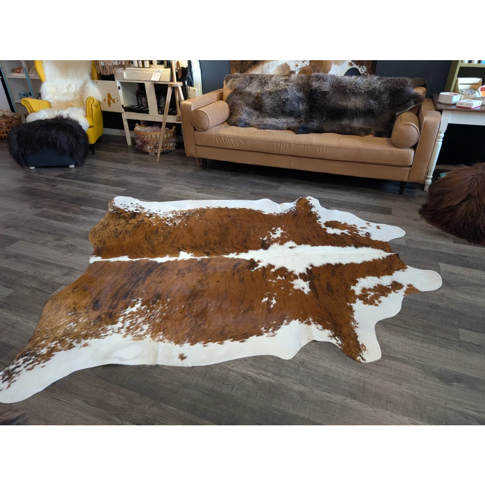 Tri600 large brown and white cowhide rug with natural irregular patterns perfect for beautiful extra large rugs