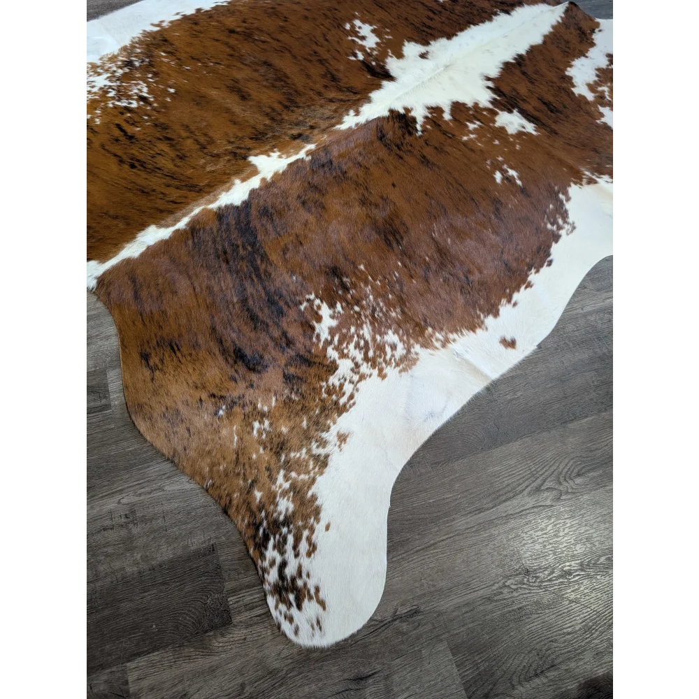 Extra large brown and white cowhide rug tri600 with natural fur texture perfect for beautiful rugs and large cowhide decor