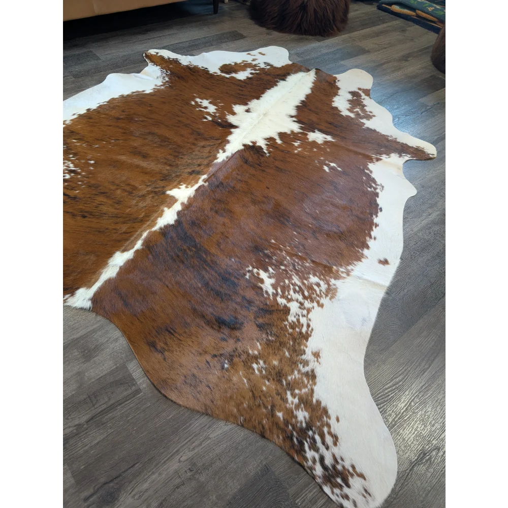 Extra large brown and white cowhide rug tri600 with natural irregular edges perfect for beautiful rugs and large cowhide lovers