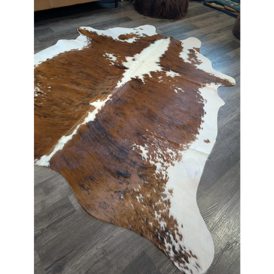 Extra large brown and white cowhide rug tri600 with natural irregular edges perfect for beautiful rugs and large cowhide lovers