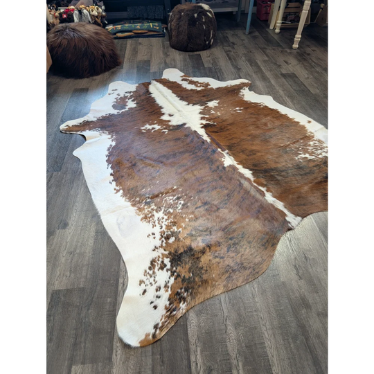 Extra large brown and white cowhide rug tri600 with natural irregular patterns perfect for beautiful rugs and large cowhide decor