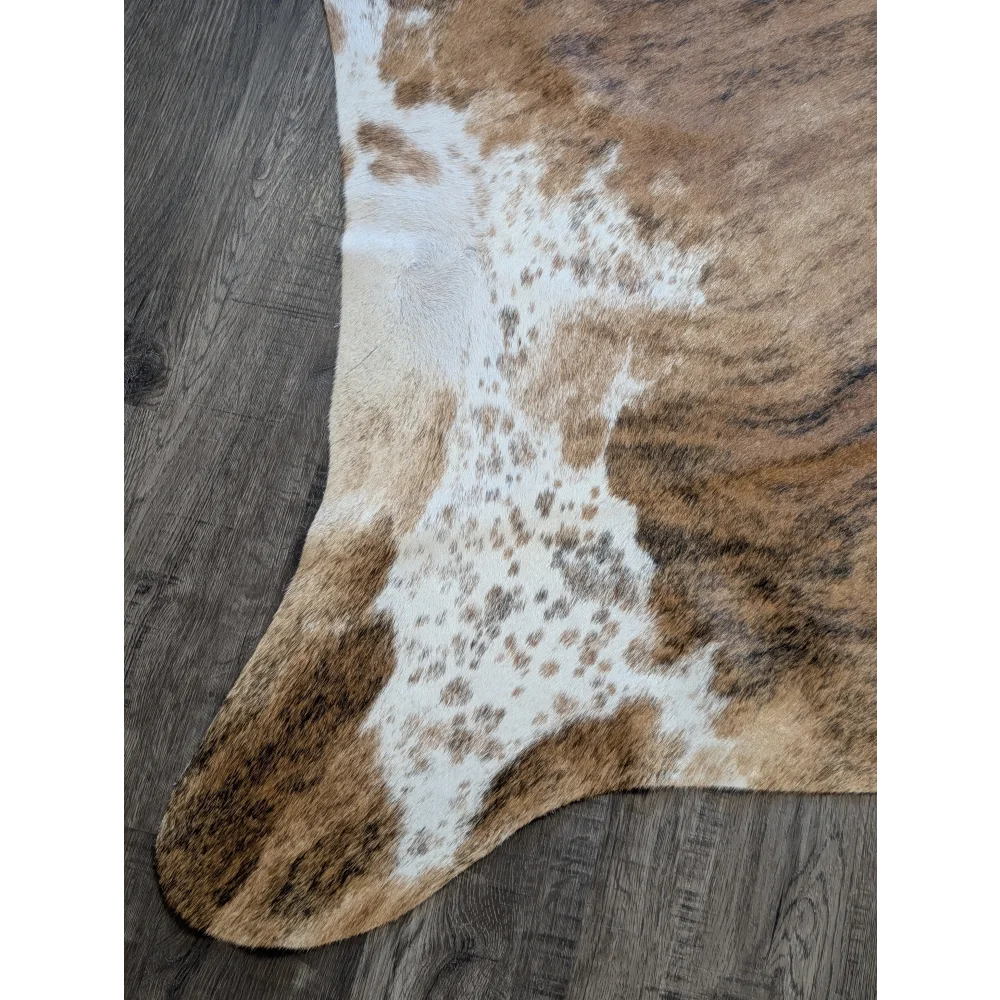Brown and white extra large cowhide rug with natural fur texture perfect for beautiful rugs and large cowhide decor