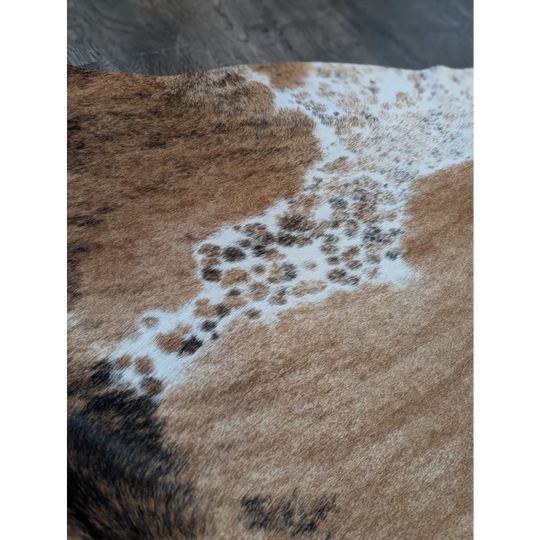 Extra large cowhide rug in brown and white with natural fur texture perfect for beautiful rugs and large cowhide decor