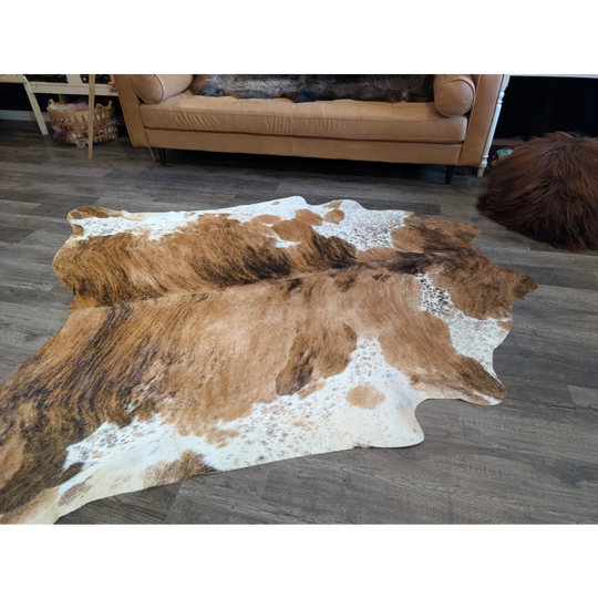 Extra large cowhide rug in brown and white with natural irregular patterns perfect for beautiful rugs and large cowhide lovers