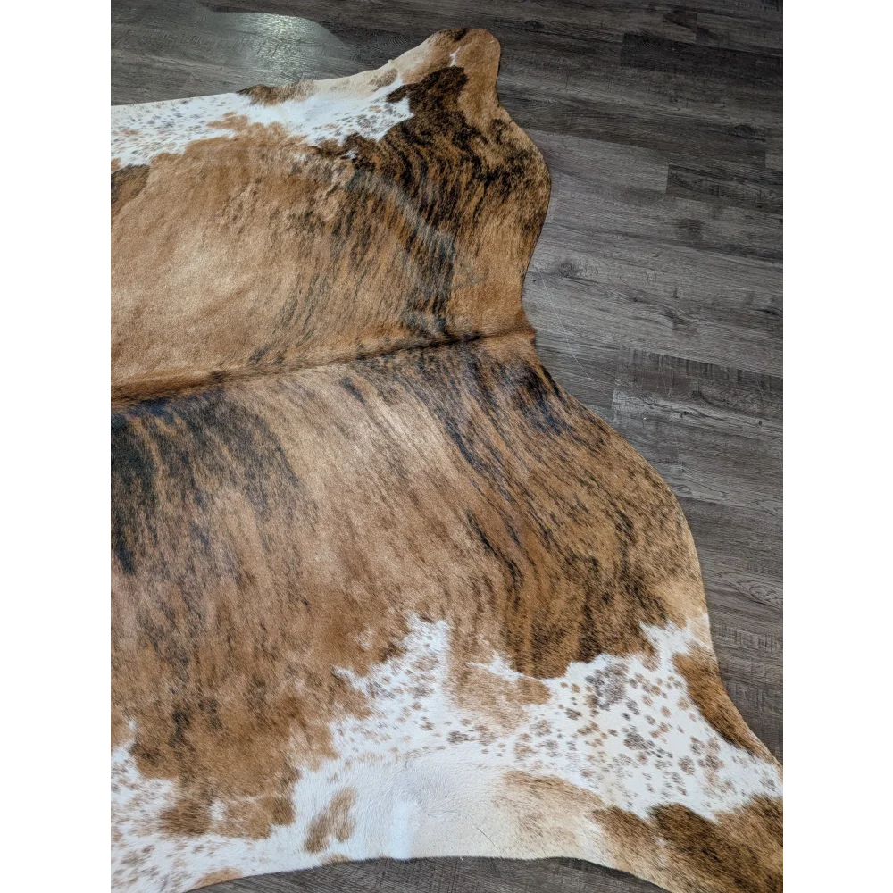 Extra large cowhide rug in brown and white with natural irregular patterns perfect for beautiful rugs and decor