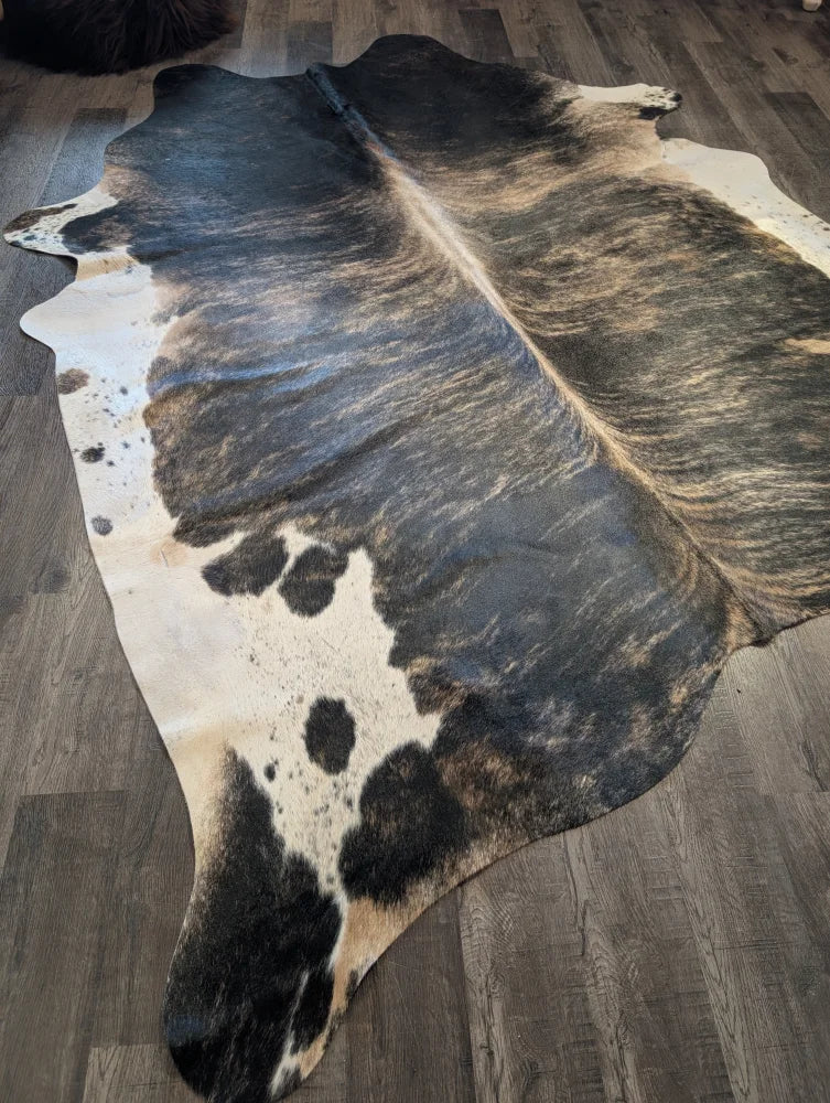 Extra large cowhide rug tri605 heart 99 x 84 natural black and white spotted large cowhide on wooden floor