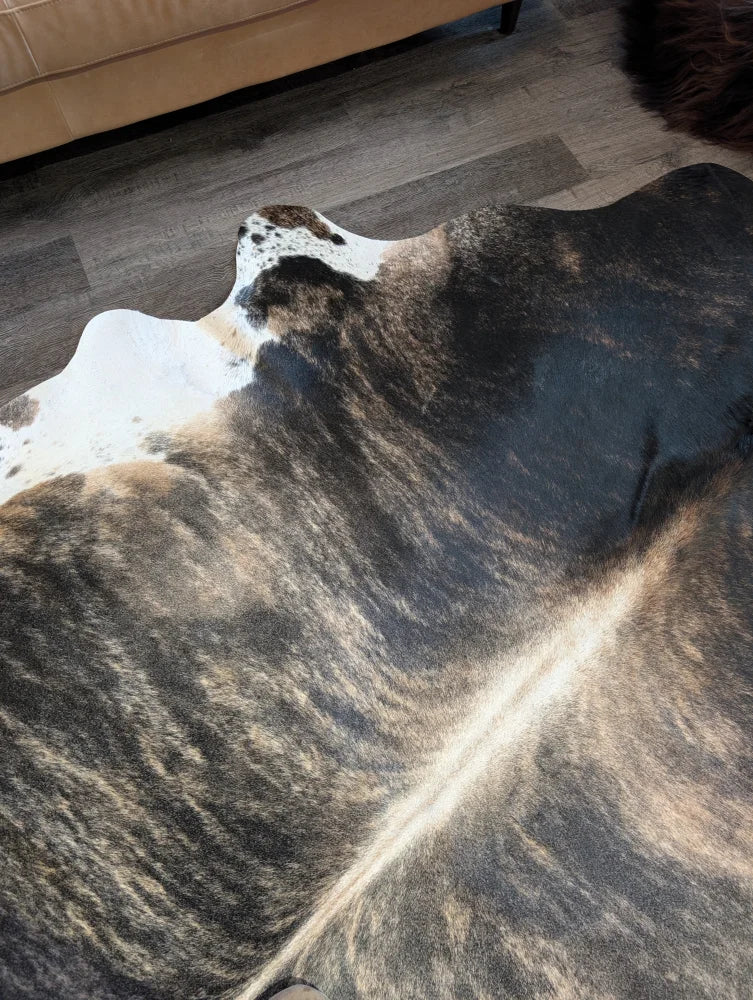 Extra large cowhide rug tri605 with beautiful natural tones and mottled black white and brown patches perfect for large cowhide decor