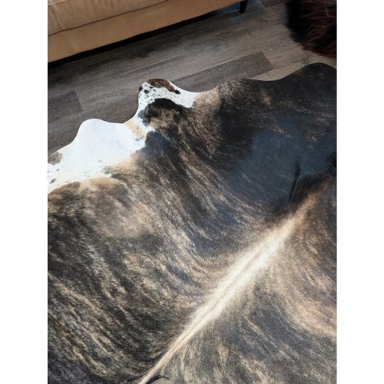 Extra large cowhide rug tri605 with beautiful natural tones and mottled black white and brown patches perfect for large cowhide decor