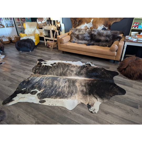 Extra large black and white natural cowhide rug with distinctive spotted pattern perfect for beautiful rugs and large cowhide decor