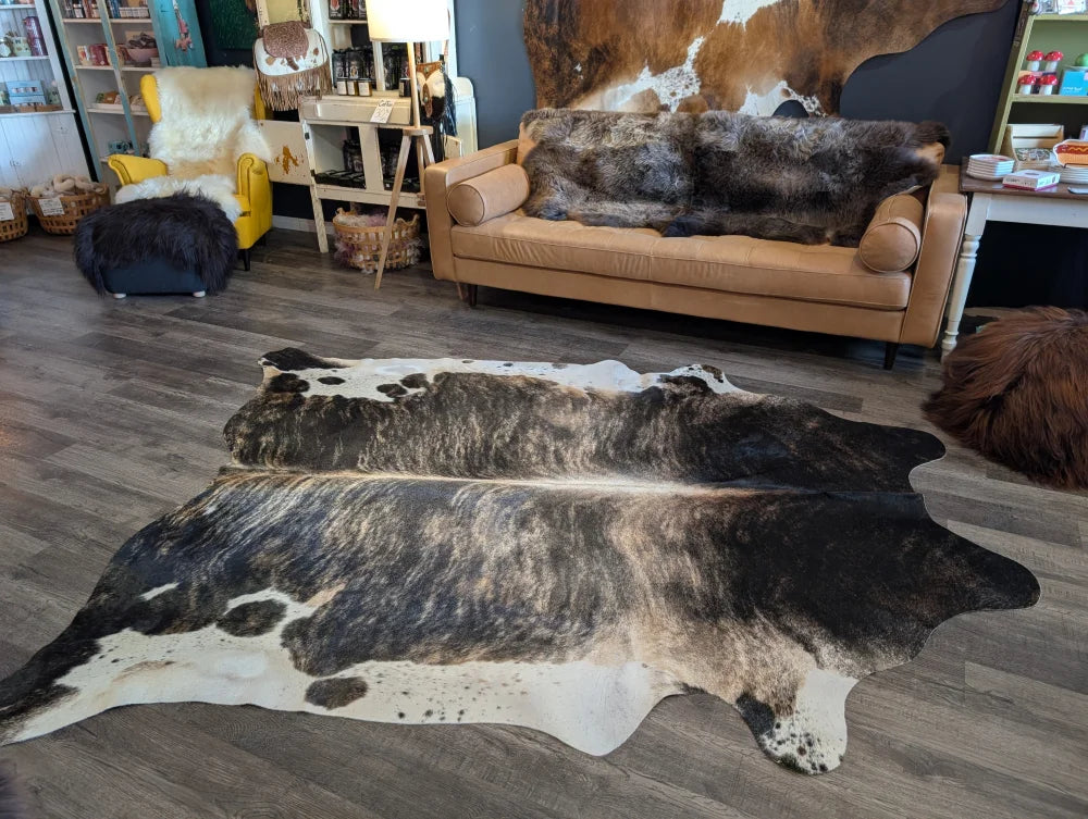 Extra large cowhide rug tri605 in natural black and white with textured unprocessed surface perfect for beautiful rugs