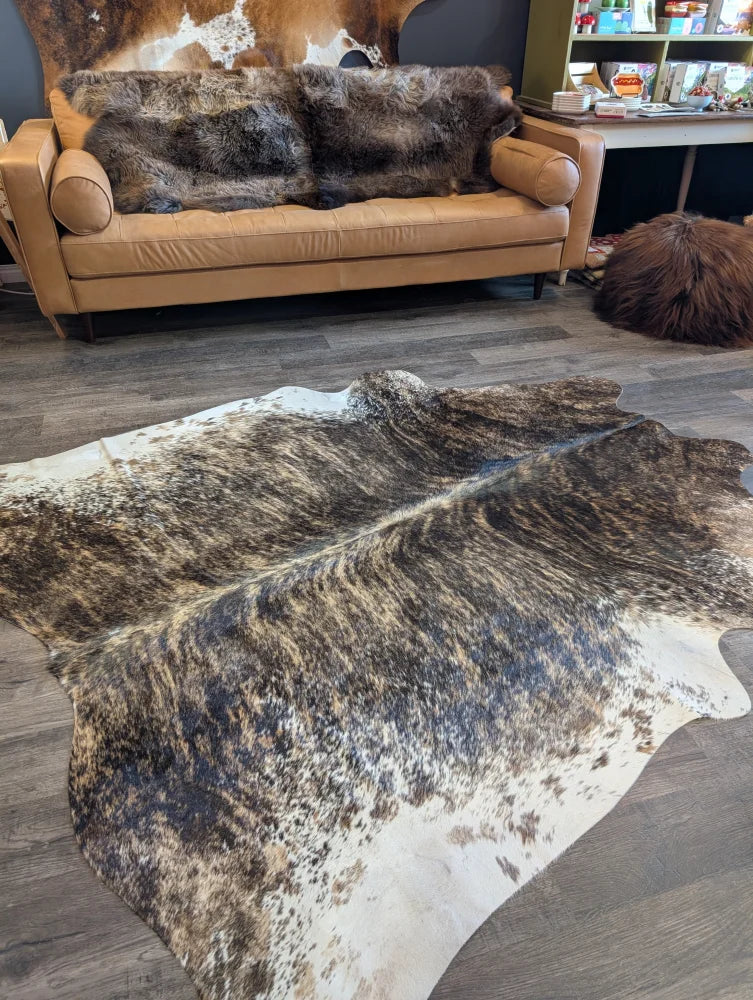 Extra large cowhide rug tri607 features a brown and white beautiful large cowhide with natural irregular patterns