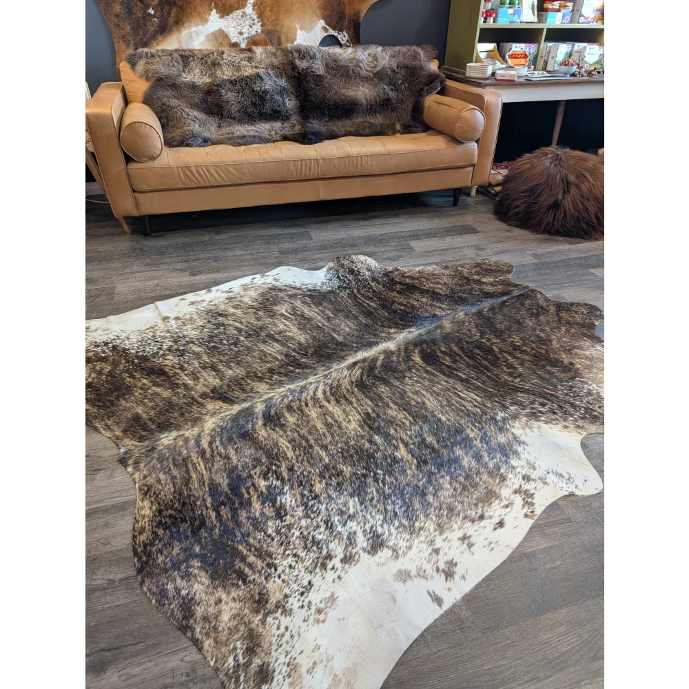 Extra large cowhide rug tri607 features a brown and white beautiful large cowhide with natural irregular patterns