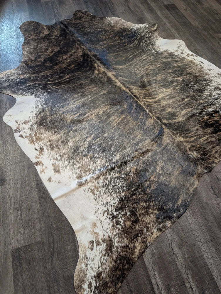 Extra large cowhide rug tri607 with a beautiful black brown and white spotted pattern perfect for large cowhide decor