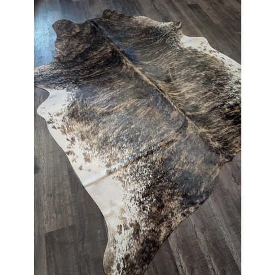Extra large cowhide rug tri607 with a beautiful black brown and white spotted pattern perfect for large cowhide decor