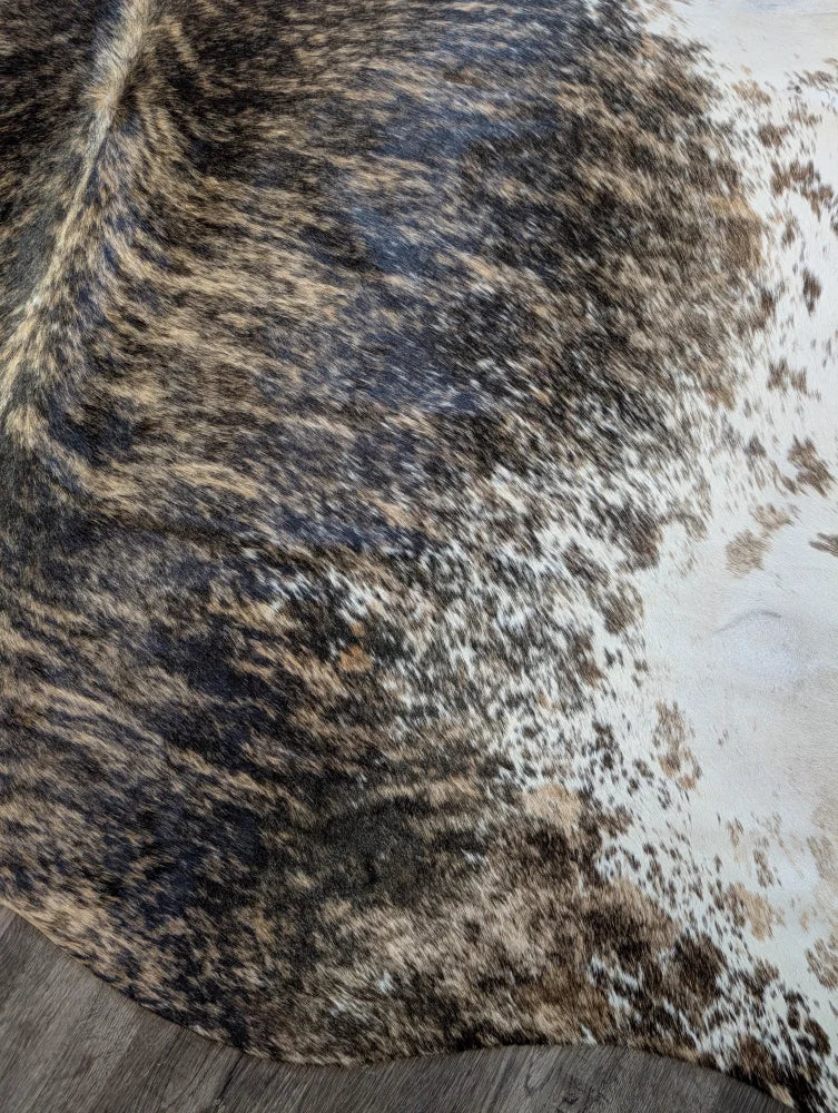 Extra large cowhide rug tri607 with a beautiful mottled black brown and white pattern perfect for large cowhide lovers