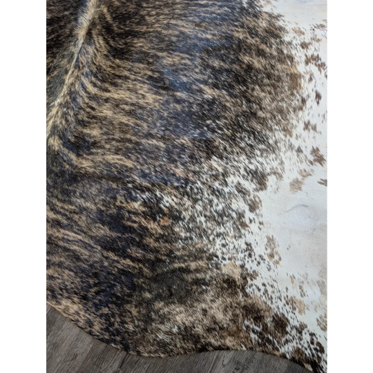 Extra large cowhide rug tri607 with a beautiful mottled black brown and white pattern perfect for large cowhide lovers