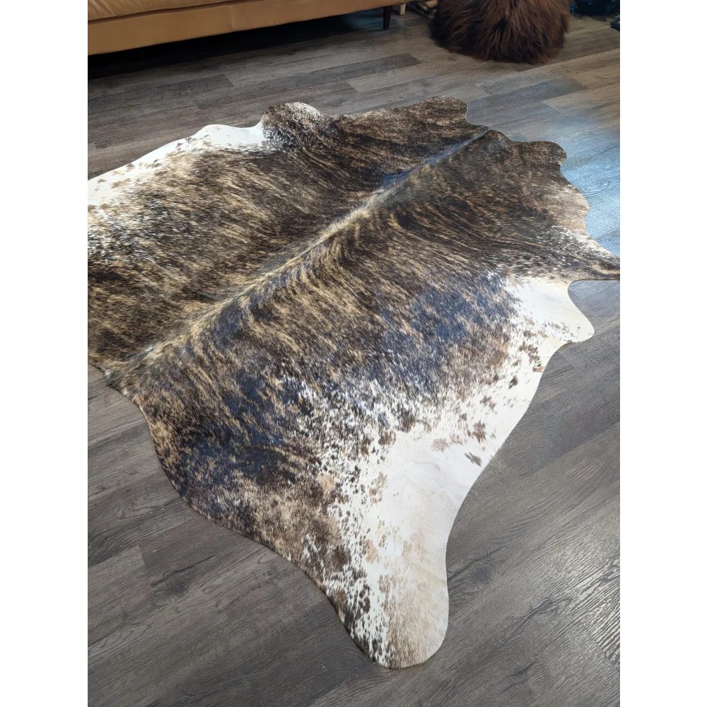 Brown and white extra large cowhide rug with natural irregular patterns perfect for beautiful rugs and large cowhide decor