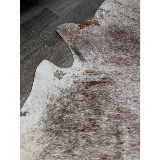 Extra large brown and white cowhide rug tri611 heart 87 x 79 with a natural textured surface perfect for beautiful rugs and large cowhide decor