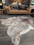 Gorgeous extra large cowhide rug in brown and white with natural fur texture perfect for beautiful rugs lovers