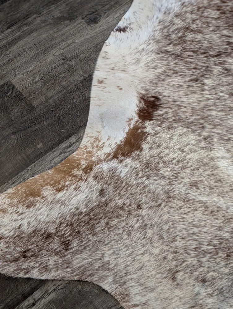 Extra large natural cowhide rug with irregular white base and brown patches perfect as beautiful rugs and large cowhide