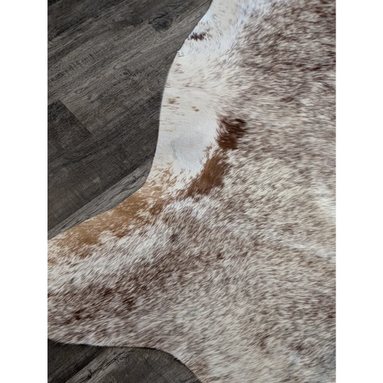 Extra large natural cowhide rug with irregular white base and brown patches perfect as beautiful rugs and large cowhide